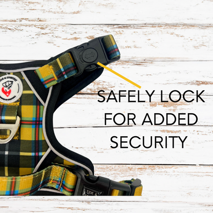 Close up of safety lock on tough dog harness in yellow and black tartan print
